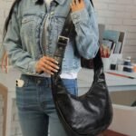 Jet Buckle-Strap Shoulder Bag in Black, view 1
