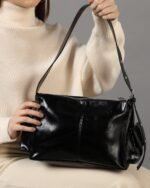 Noir Buckle-Strap Shoulder Bag in Black, view 1