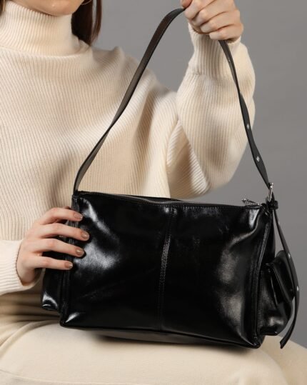 Noir Buckle-Strap Shoulder Bag in Black, view 1
