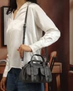 Onyx Flap-Pocket Sling Bag in Black, view 1